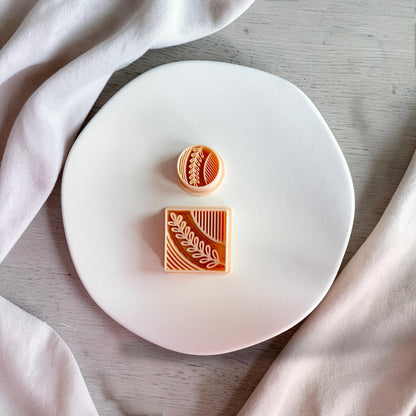 Botanical leaf polymer clay cutter on white plate
