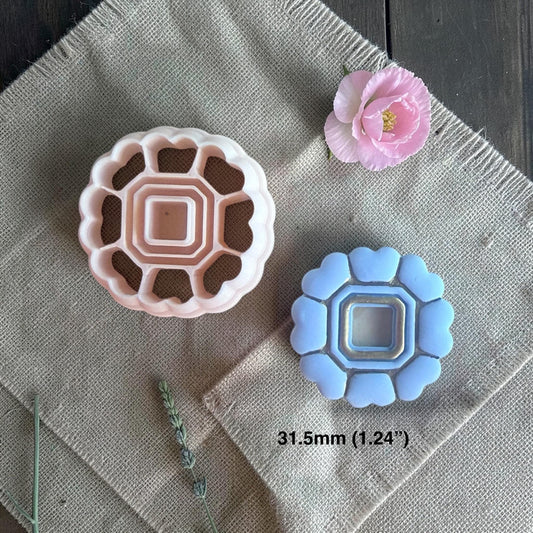 Two color variations of heart frame cutter showing design detail and depth