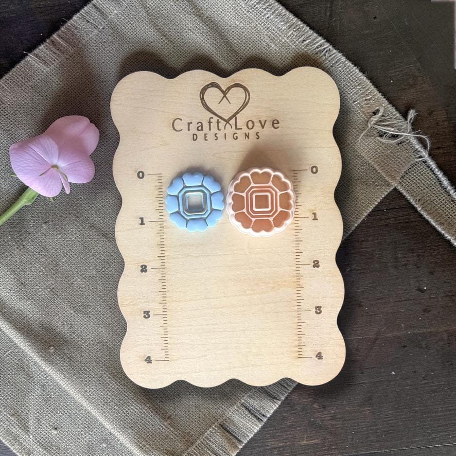 Polymer clay cutter set shown on measurement board for size reference