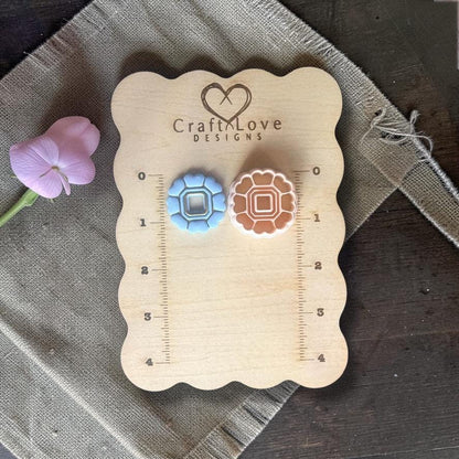 Polymer clay cutter set shown on measurement board for size reference