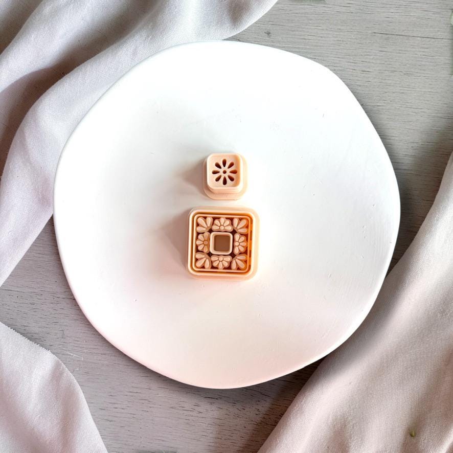 Square floral cutter with detailed tile pattern and matching stud topper