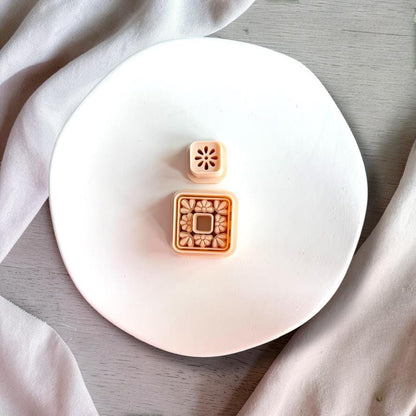 Square floral cutter with detailed tile pattern and matching stud topper