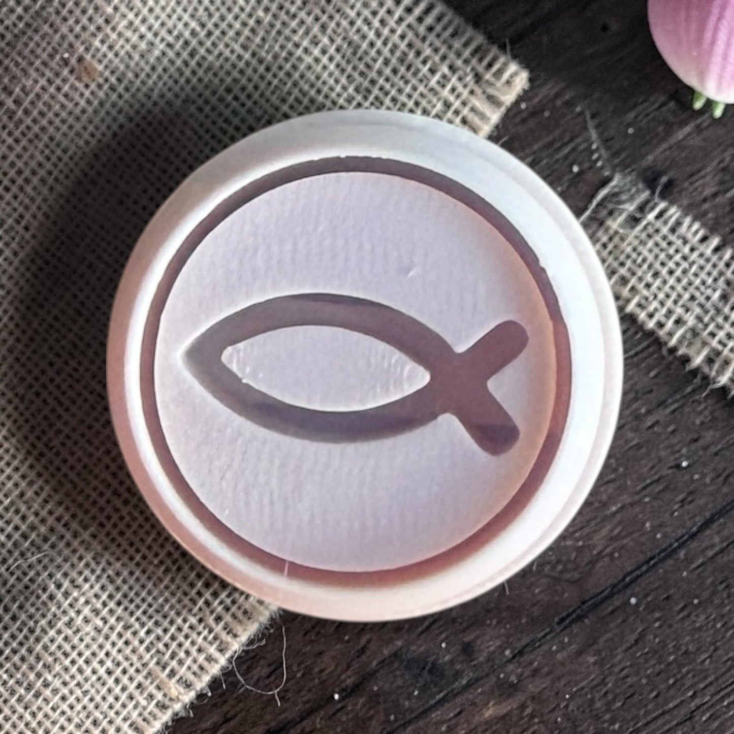 Round polymer clay cutter showing Ichthys fish design inside circular frame