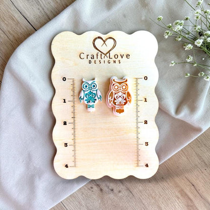 Folk art owl polymer clay cutter displayed on measurement board for size reference