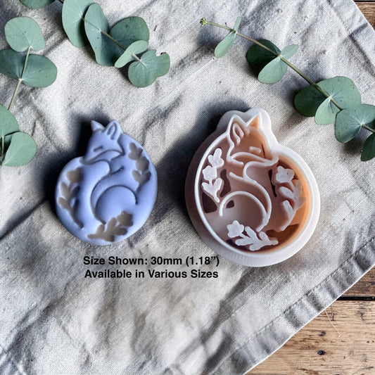 fox clay cutter and finished fox charm with size text on linen