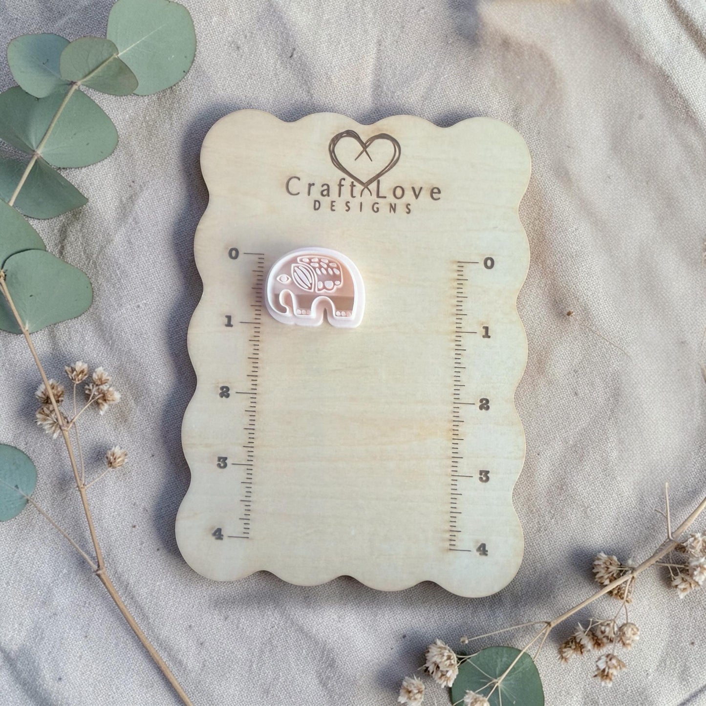 white elephant clay cutter displayed on Craft Love Designs ruler board