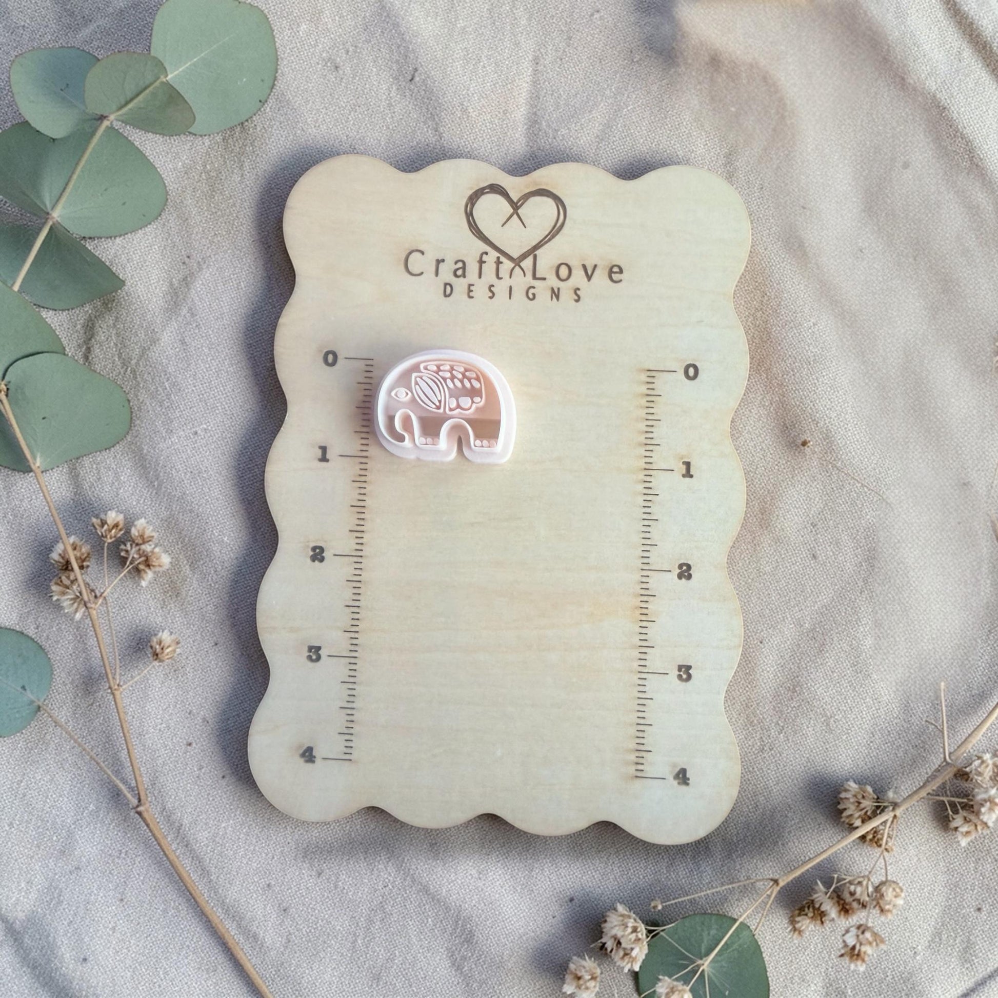 white elephant clay cutter displayed on Craft Love Designs ruler board