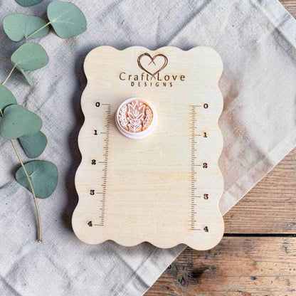 white tulip clay cutter displayed on Craft Love Designs ruler board
