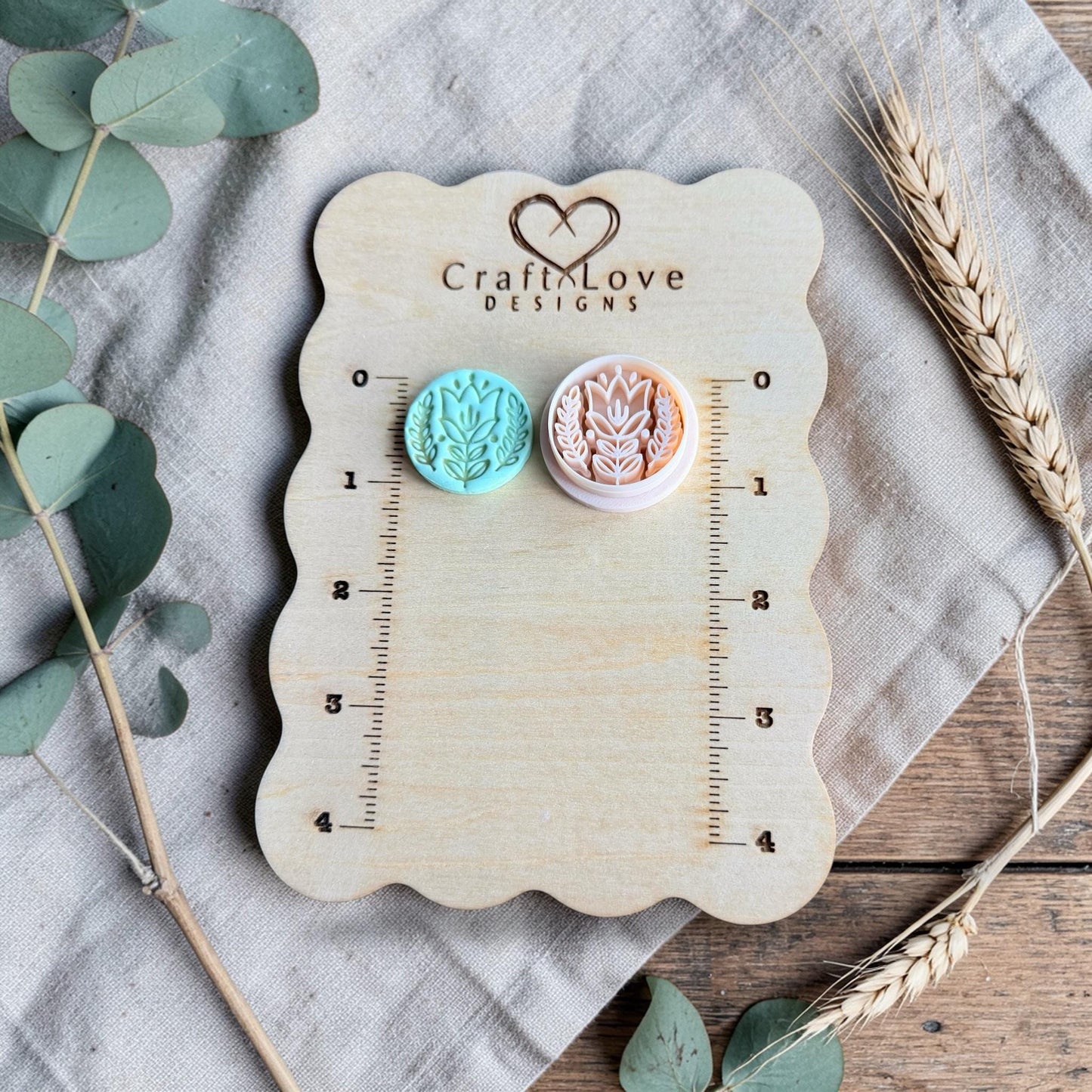 turquoise tulip clay charm and cutter on Craft Love Designs ruler board