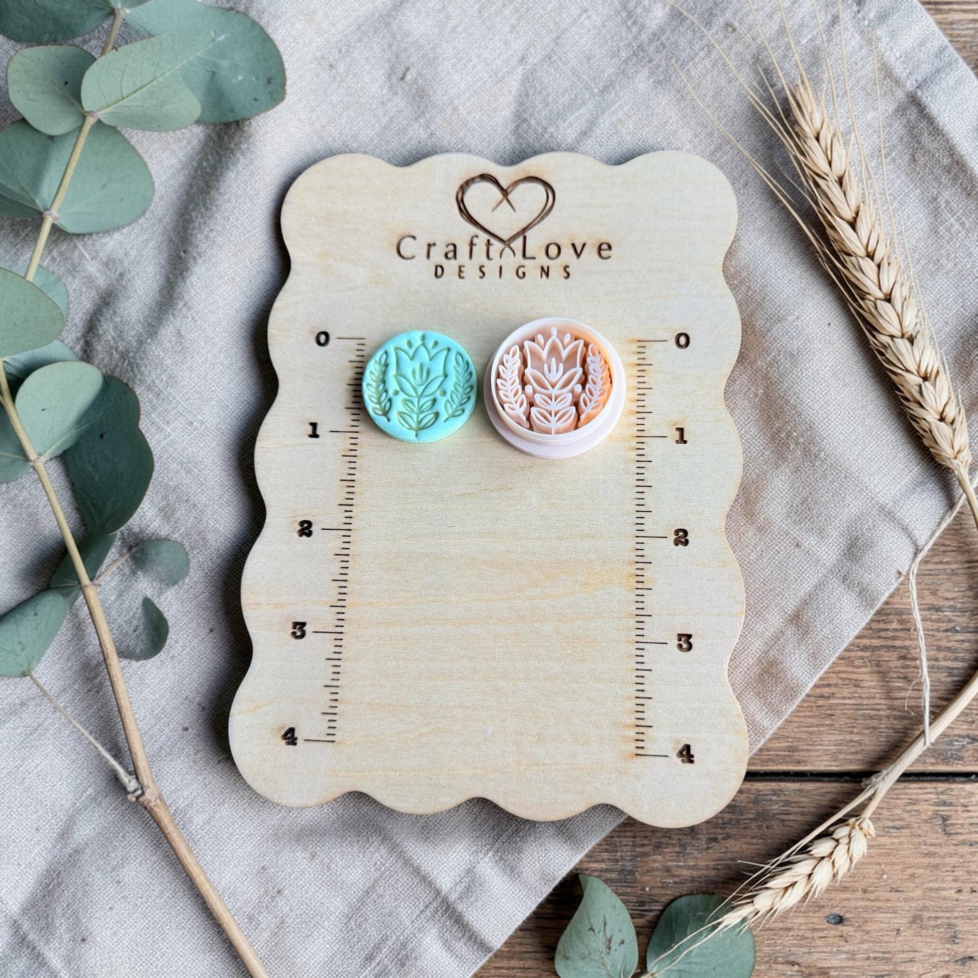 turquoise tulip clay charm and cutter on Craft Love Designs ruler board