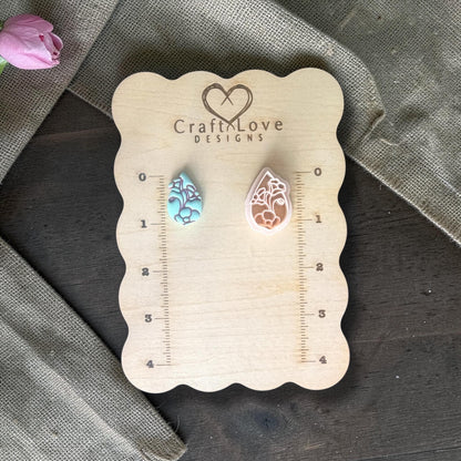 Polymer clay cutter next to sample clay piece.