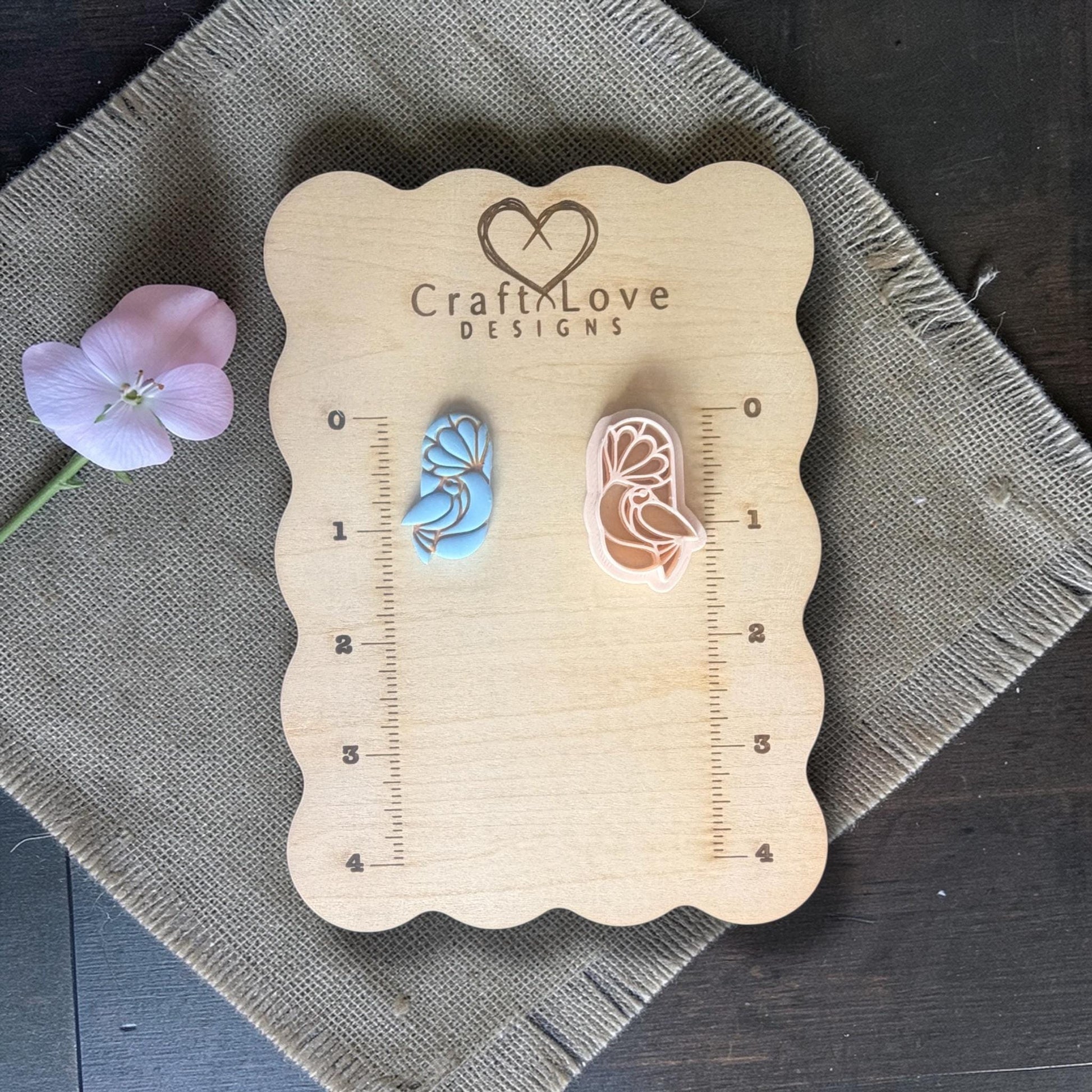 Polymer clay cutter next to sample clay piece.