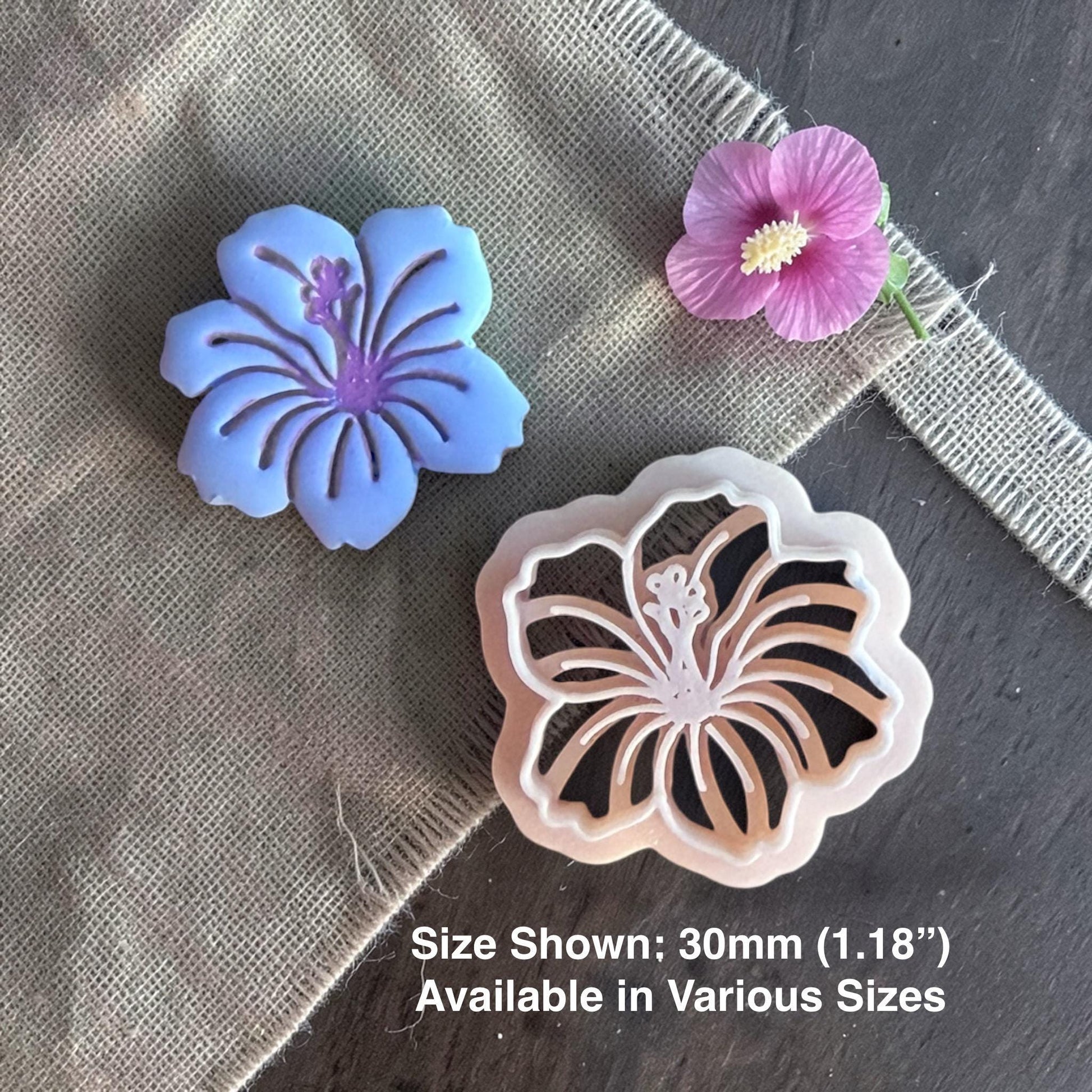 Hibiscus clay cutter next to finished clay piece.