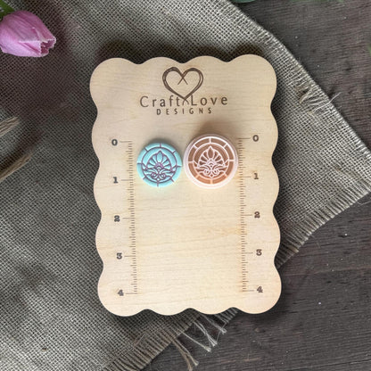 Floral clay cutter next to stained glass flower clay piece.