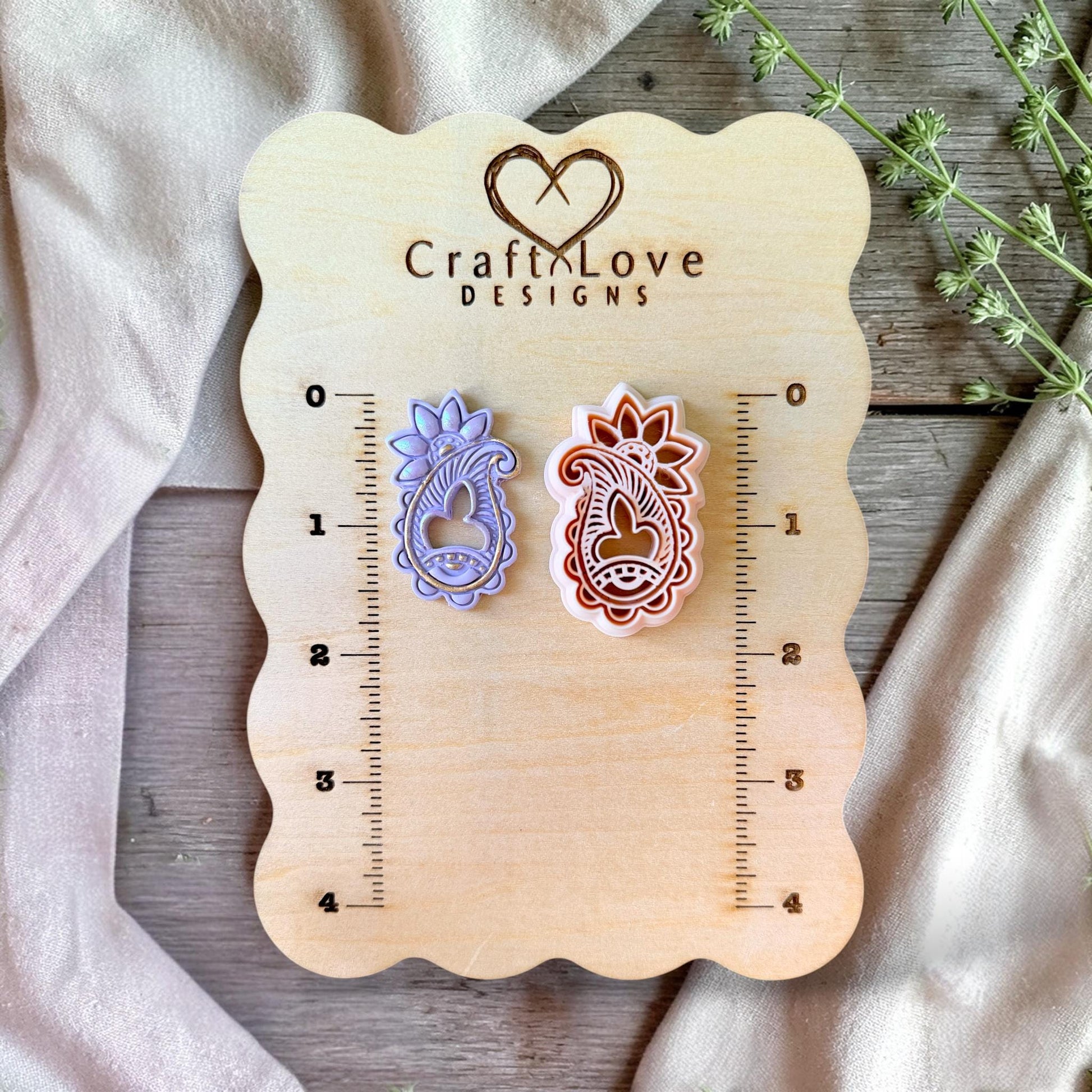 43mm paisley cutter displayed with finished example for size reference