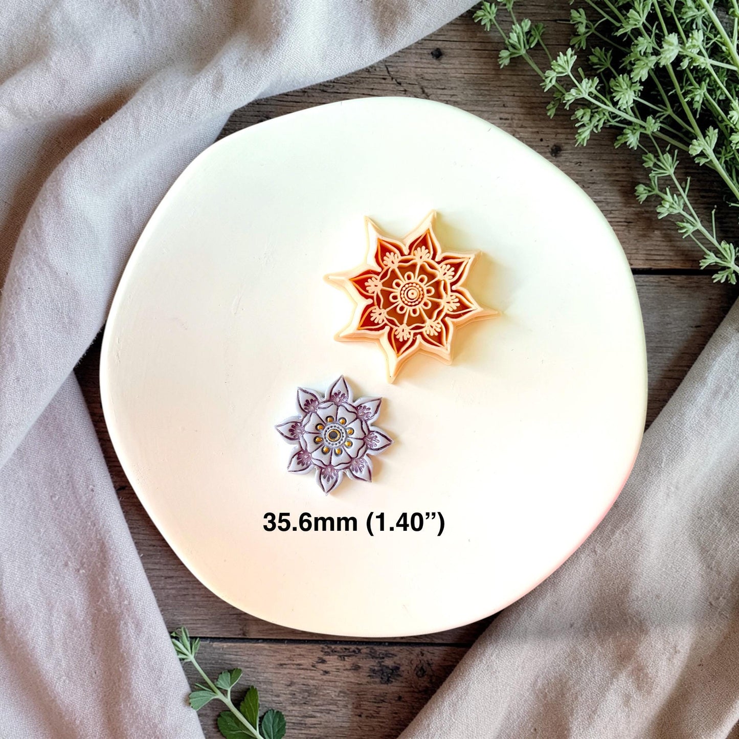 Floral mandala clay cutter close up showing detailed layered flower pattern for polymer clay jewelry