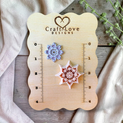 Polymer clay cutter and finished floral mandala earring side by side showing detail and scale