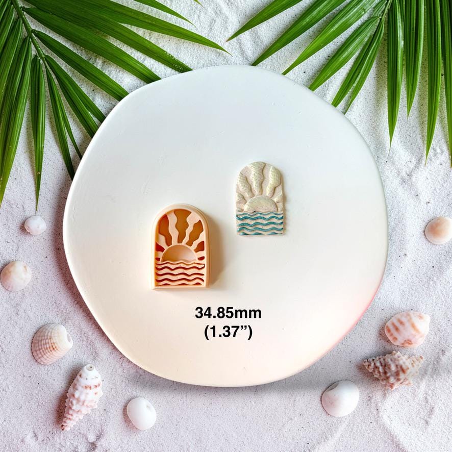 Polymer clay cutter and finished ocean sunrise earring side by side showing 34.85mm size