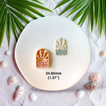 Polymer clay cutter and finished ocean sunrise earring side by side showing 34.85mm size