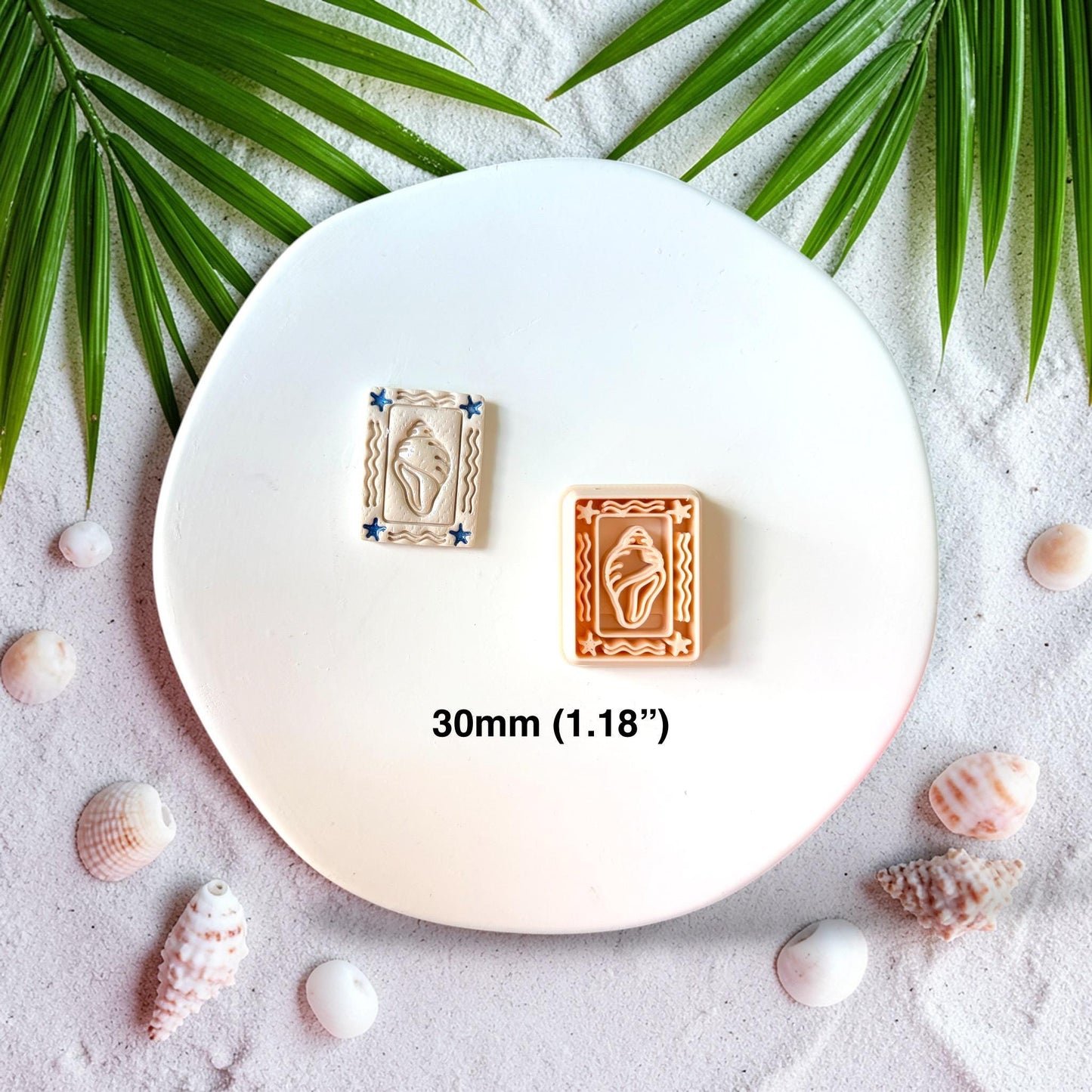 Polymer clay cutter and finished seashell earring side by side showing 30mm size