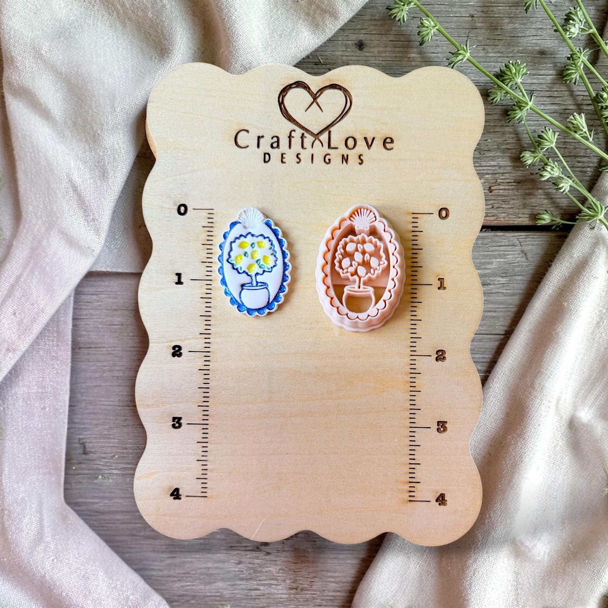 Lemon tree polymer clay cutters displayed on wooden sizing board with ruler