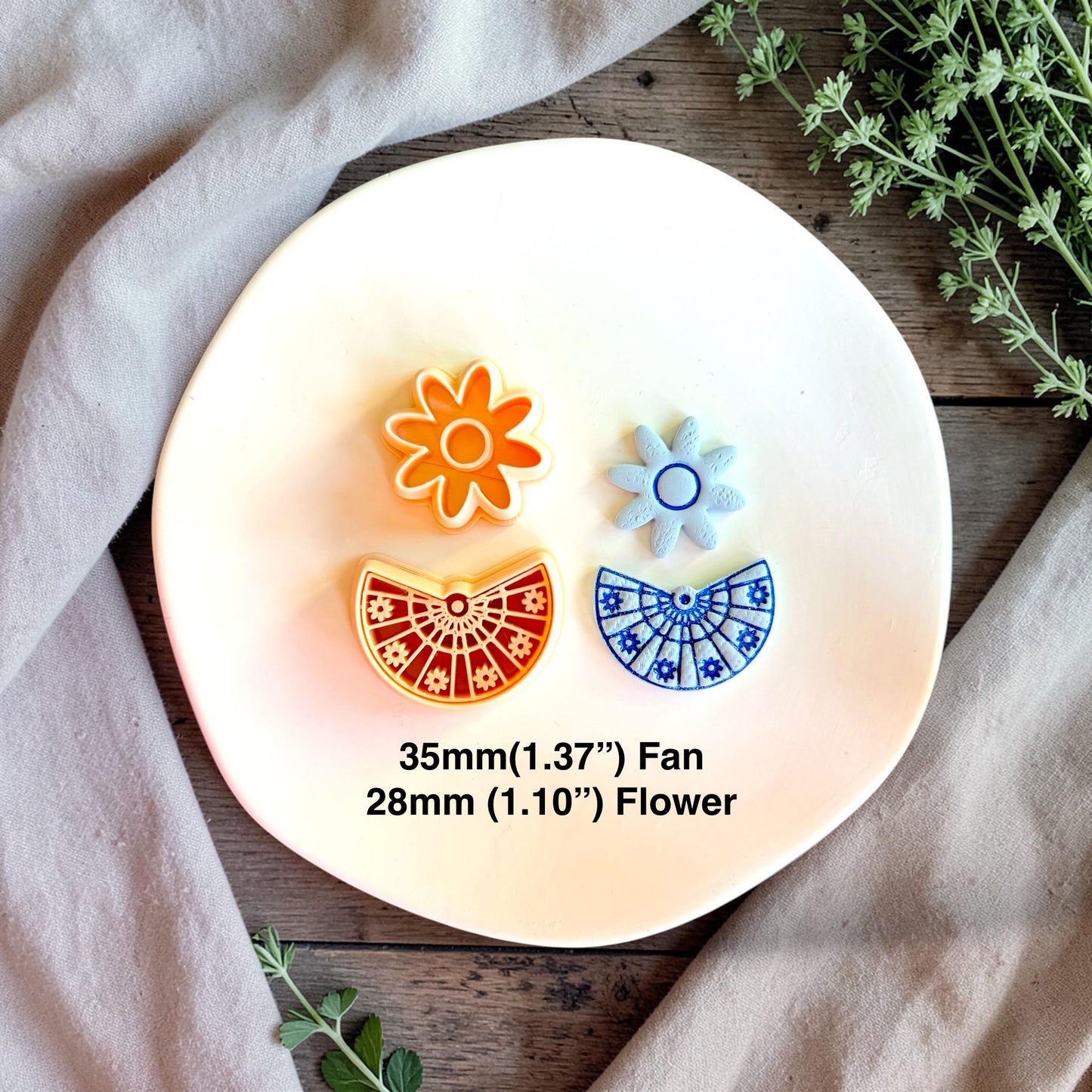 Cutter set with finished blue floral earrings showing daisy stud and fan dangle size reference