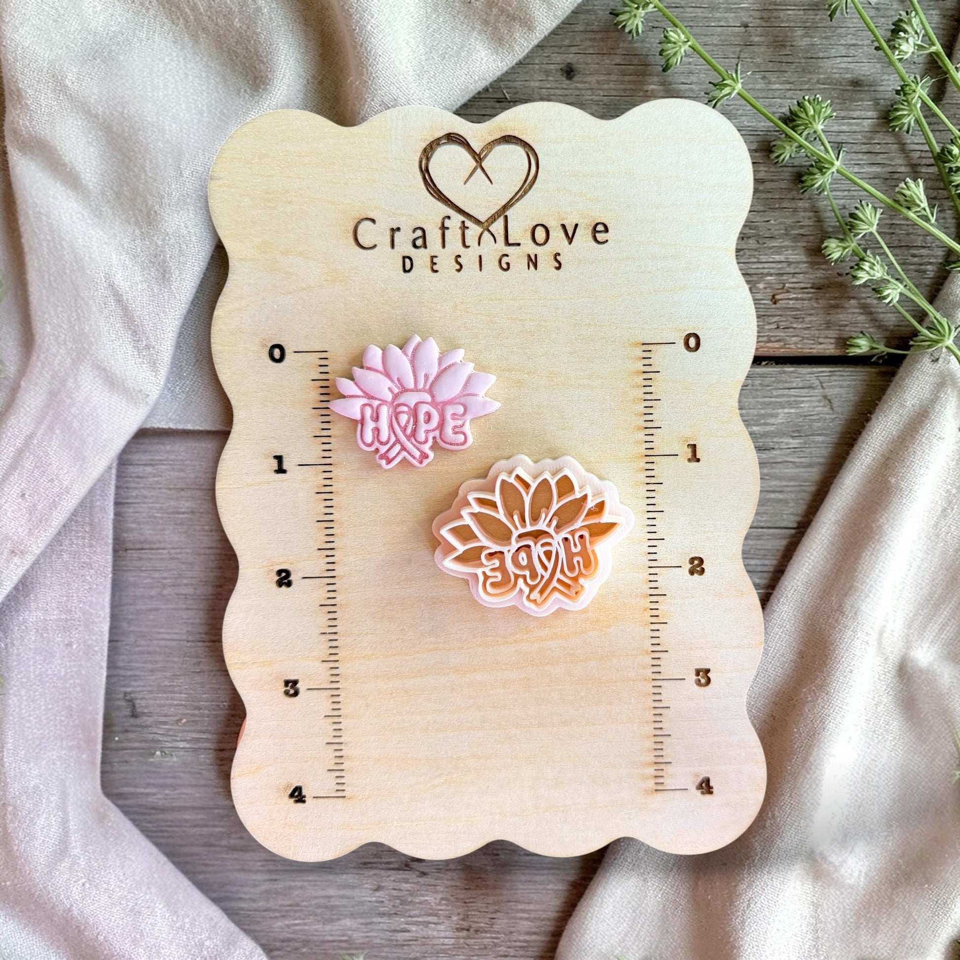 Polymer clay cutter displayed on measurement board showing size and scale for earring making