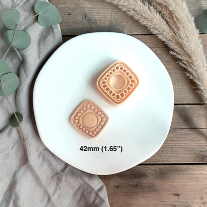 Two clay pieces and cutter displayed together with size text 42mm on a white plate with soft neutral styling.