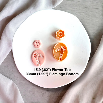 Polymer clay flamingo cutter set with flower topper and finished clay pieces showing size 33mm and 15.9mm.