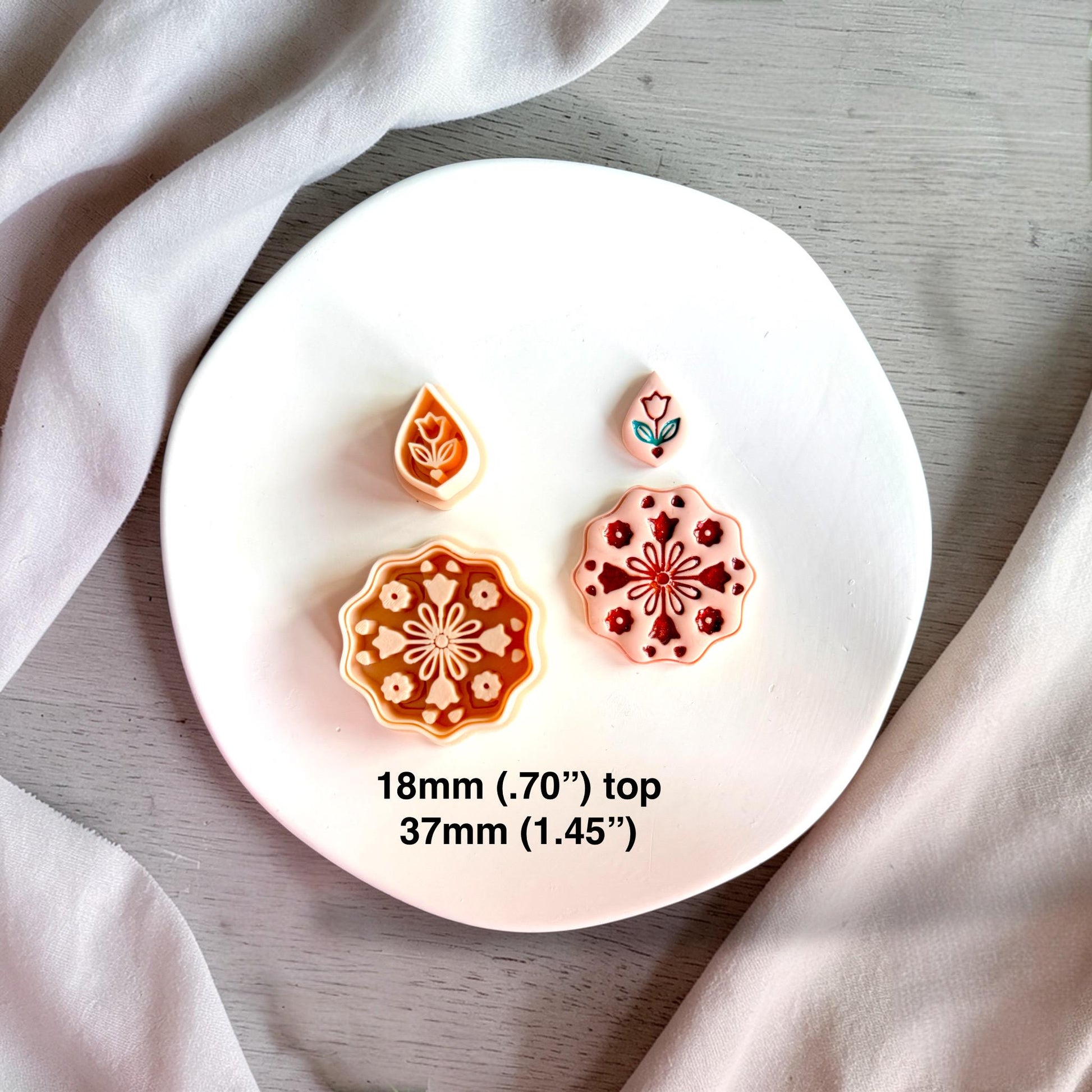 Floral mandala cutter set showing size 37mm bottom and 18mm top with example pieces