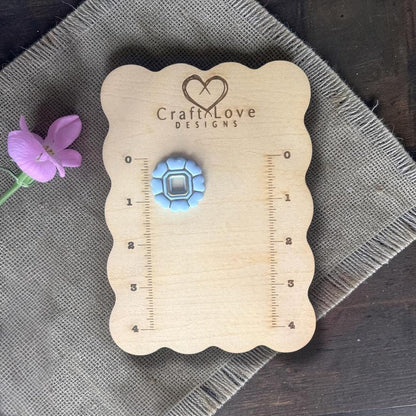 Blue and pink versions of scalloped heart clay cutter side by side