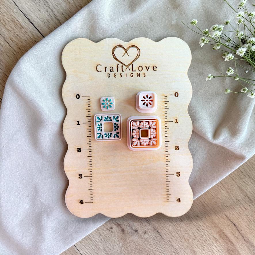 Polymer clay cutters displayed on sizing board showing scale and design detail