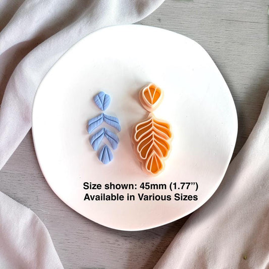 Layered fern leaf cutter with blue clay example and 45mm size shown