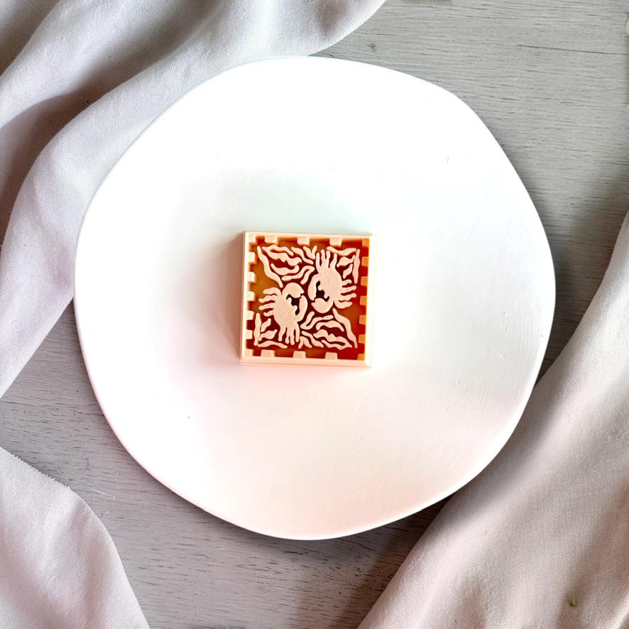 Close-up of square crab tile design cutter
