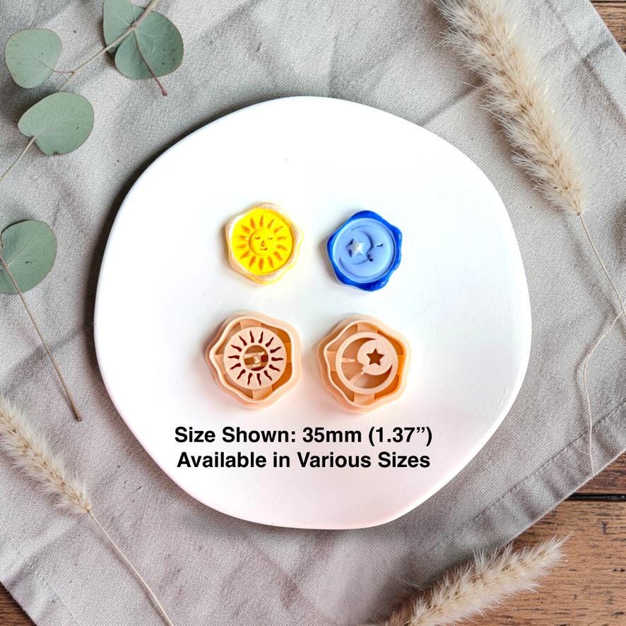 sun and moon clay cutters with colorful clay samples and 35mm size reference on white plate