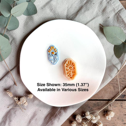 Sky and moon clay samples with cutter showing 35mm size reference on white plate
