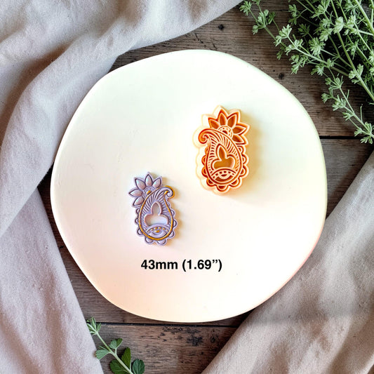 Finished clay earring piece made with paisley cutter