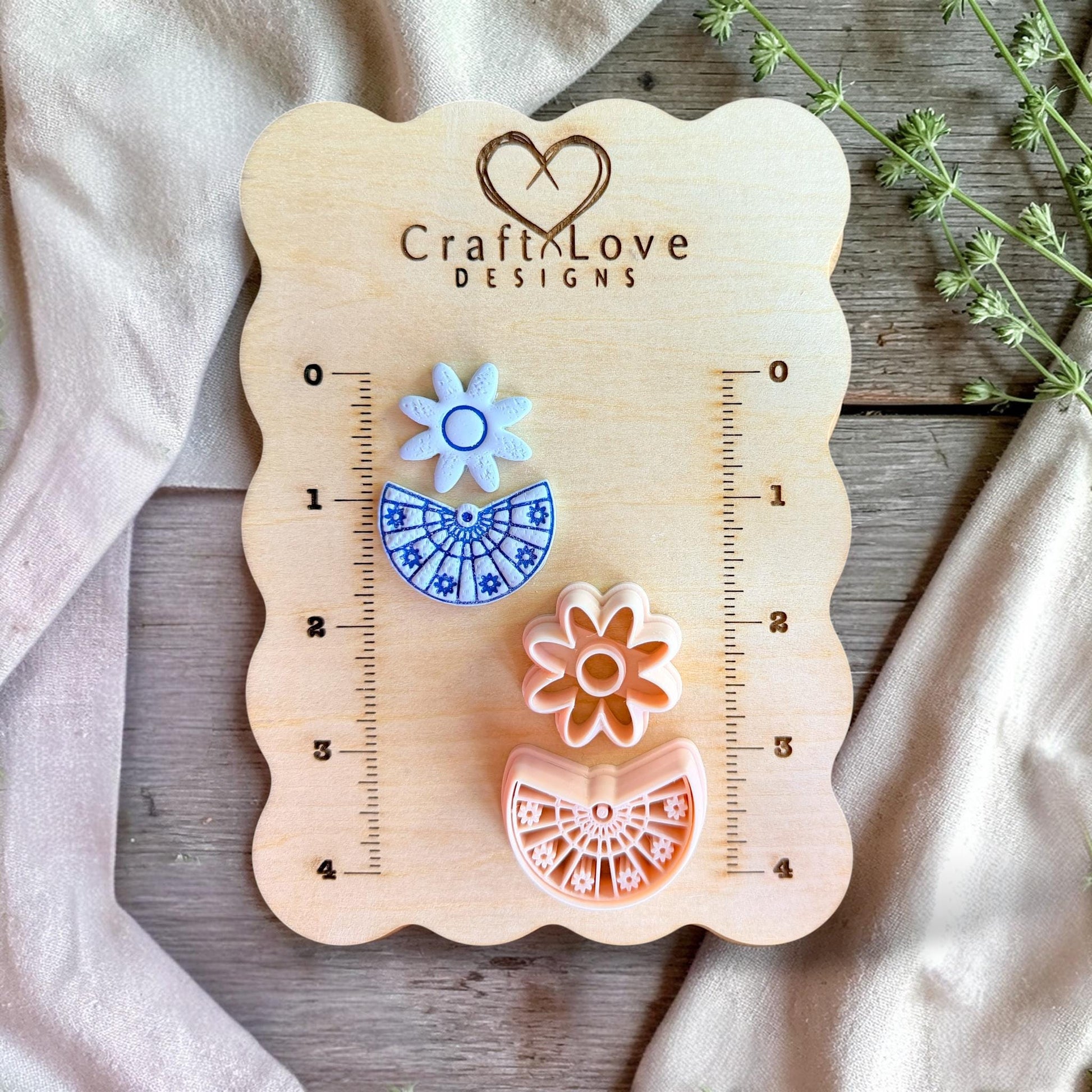 Clay cutters displayed on measurement board showing size and scale for earring making