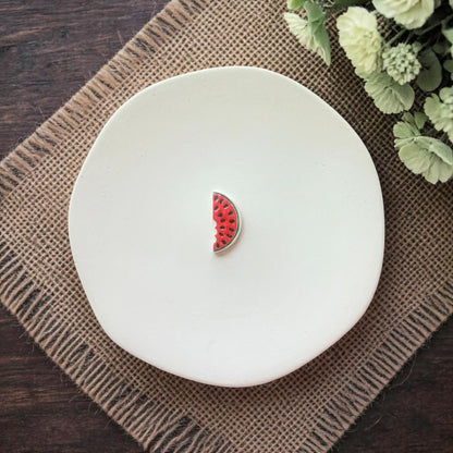 Finished watermelon slice with bite detail in red and green