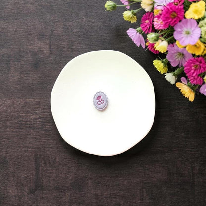 Small cherry design clay impression in pastel purple clay