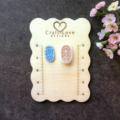Floral tile polymer clay cutter shown on wooden size board