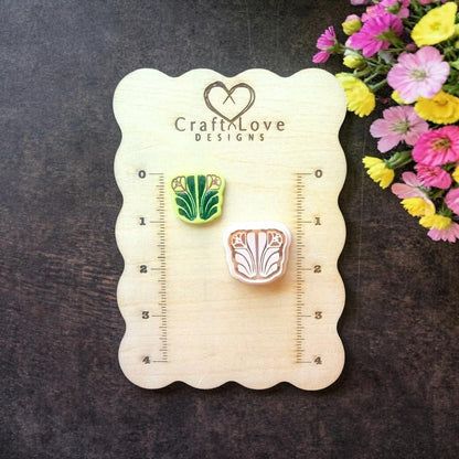 Art nouveau floral polymer clay cutter on wooden size board