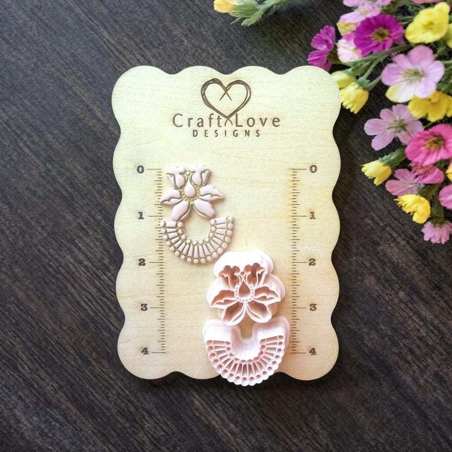 Floral arch polymer clay cutter set displayed on wooden size board