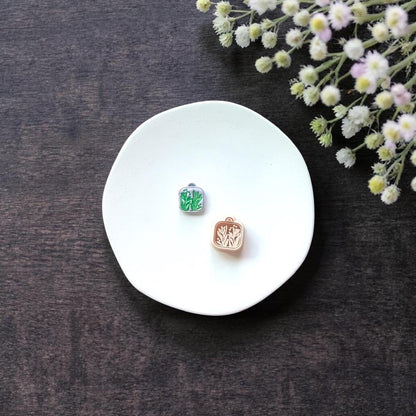 Single square floral locket cutter style 3 on white background with cutter