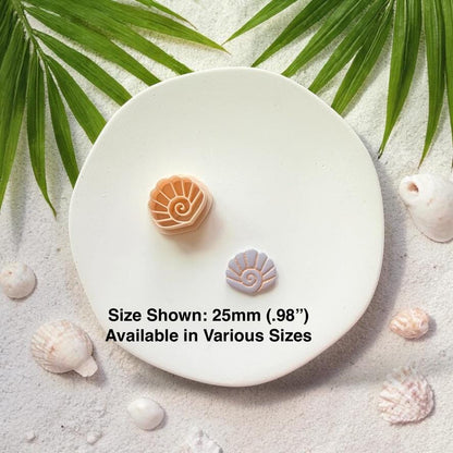 Seashell cutter and finished shell piece shown together with 25mm size text