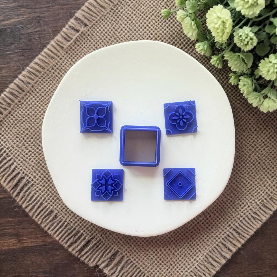 Azulejos mosaic tile patterns in blue and neutral tones with detailed impressions