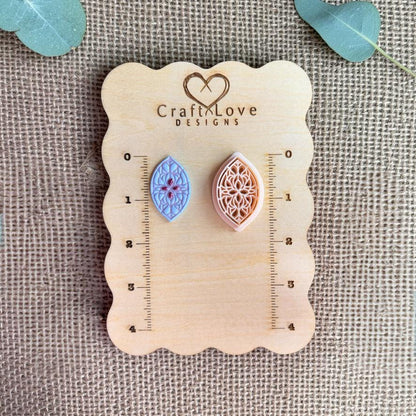 Teardrop clay cutter and finished piece displayed on wooden measurement board