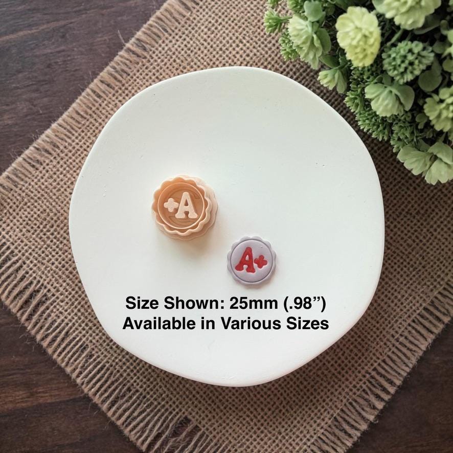 A plus clay earrings with size text shown 25mm