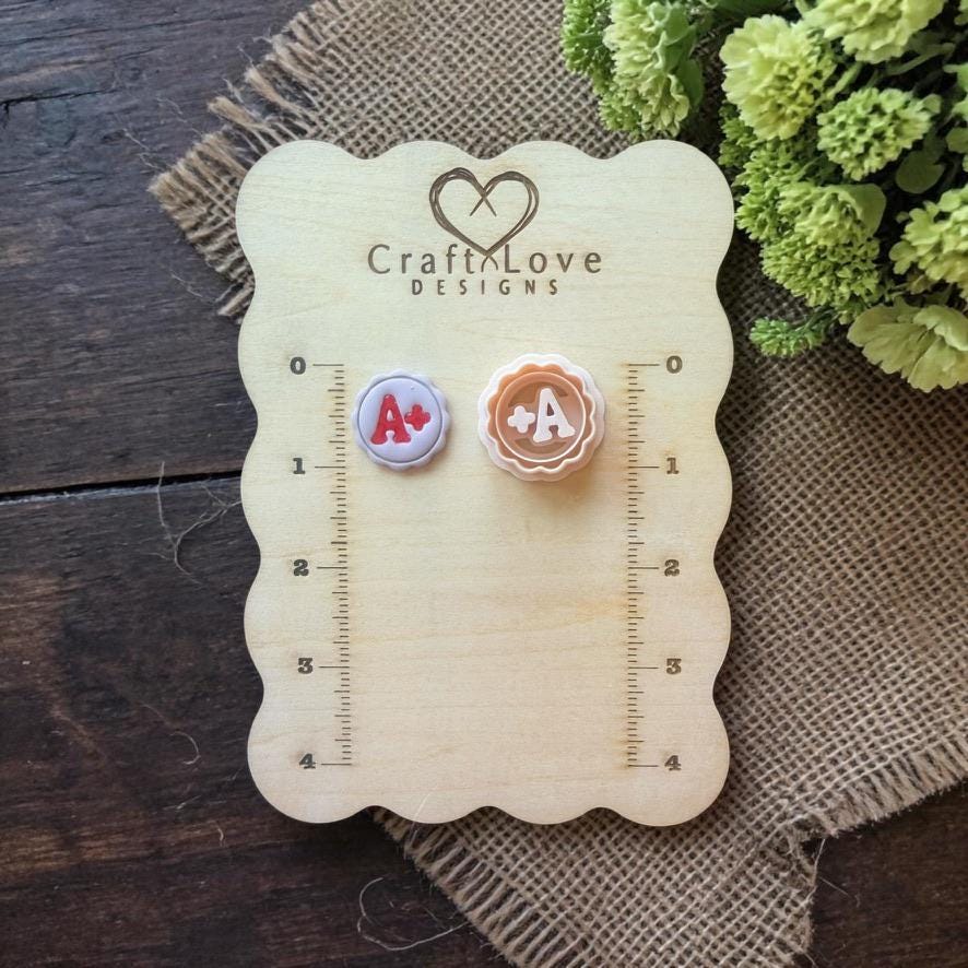A plus cutter displayed on wooden ruler board with measurements
