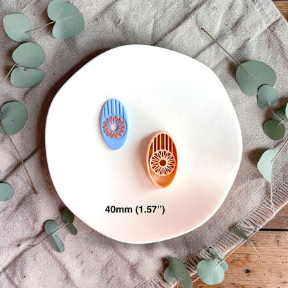 Oval cutter and clay piece displayed with 40mm size reference